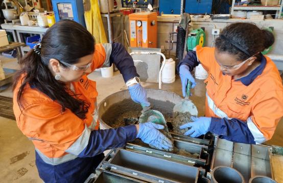 Lead Entrepreneur Dr Juliana Segura-Salazar (left) and project fellow Dr Lulit Habte Ekubatsion (right) at The University of Queensland’s School of Civil Engineering Concrete Laboratory at St Lucia.