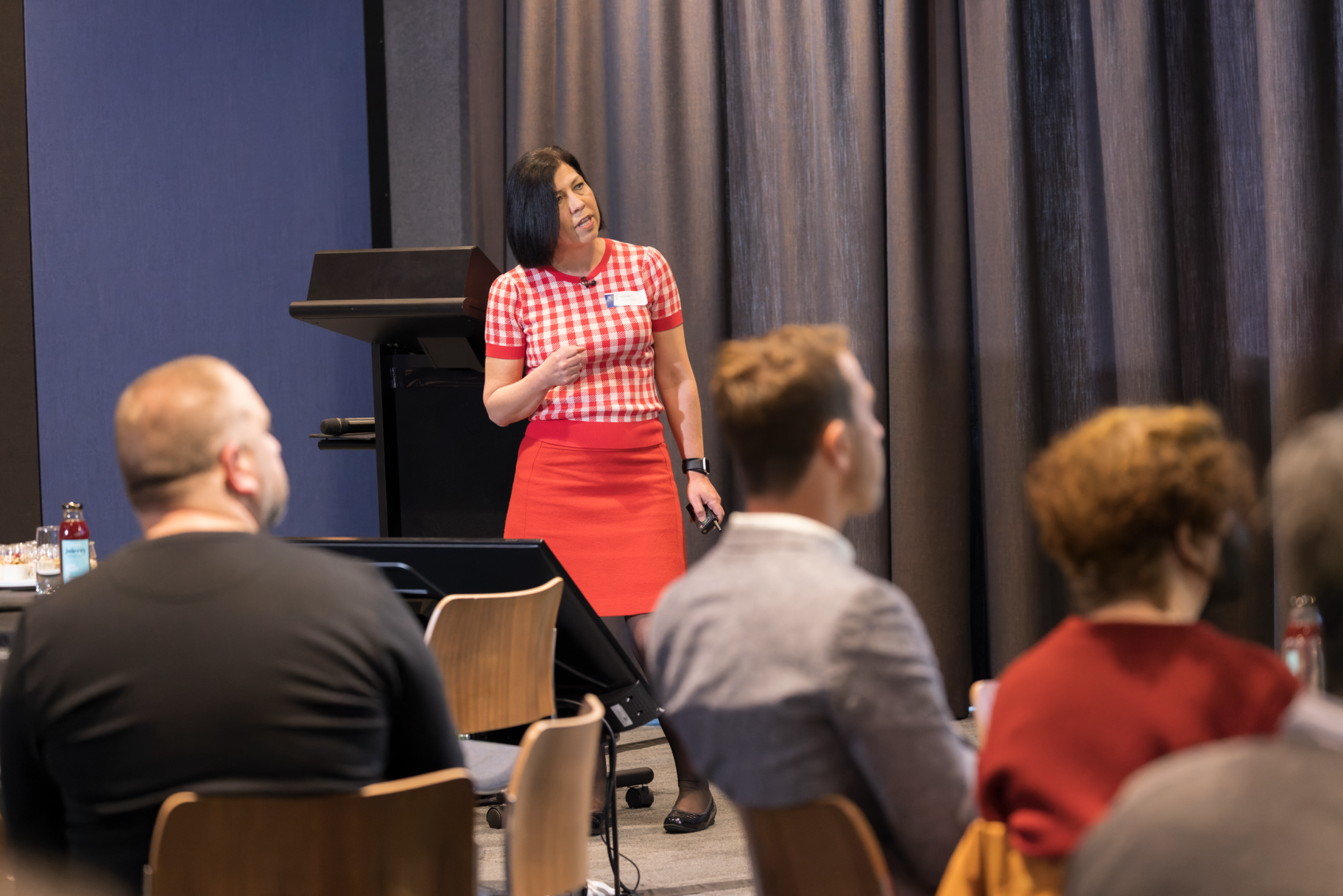 Image of person standing in front of a lectern