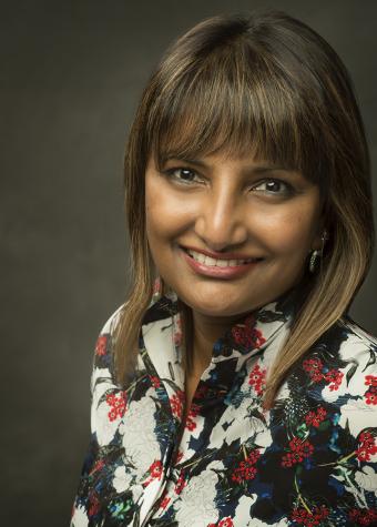 Headshot of Dr Angeline Achariya smiling at camera